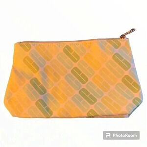 Clinique’s green & white ladies makeup bag great for travel